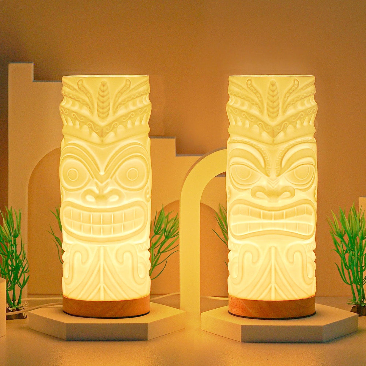 Pair of 3D printed tiki lamps, Smile and Stern, glowing warm white